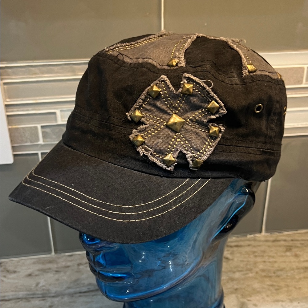 Buckle hat with cross and moto edge with metal embellishments